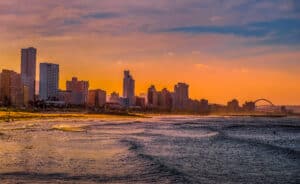 Durban golden mile beach with white sand and skyline South Africa