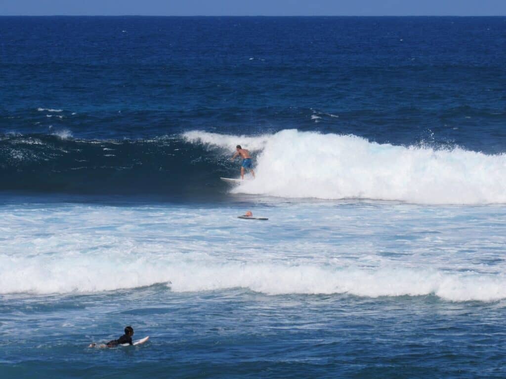 Surfer on Ho'okipa Beach near Mama's Fish House
