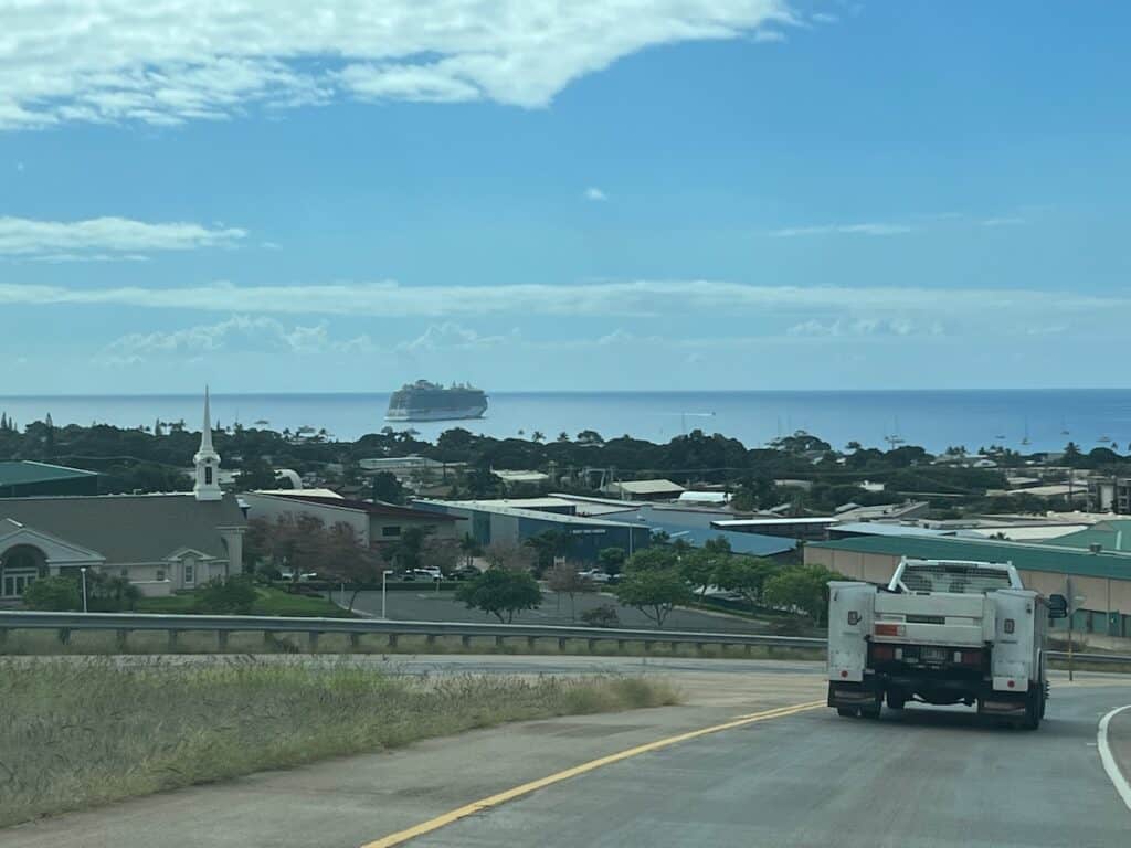 Driving toward Lahina with a cruise ship in the background