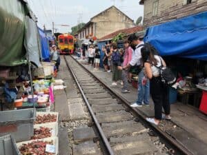 Train entering the Maeklong Railway market