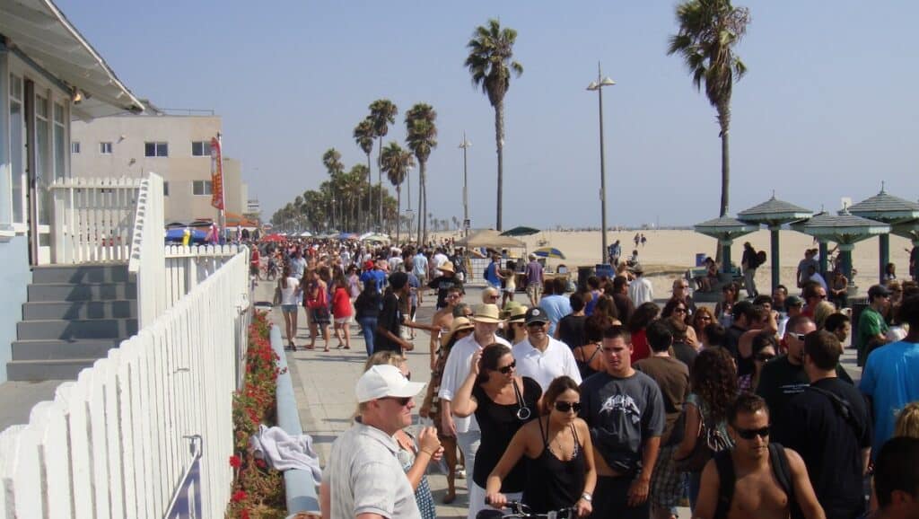 People walking on the Boardwalk at Venice Beach CA