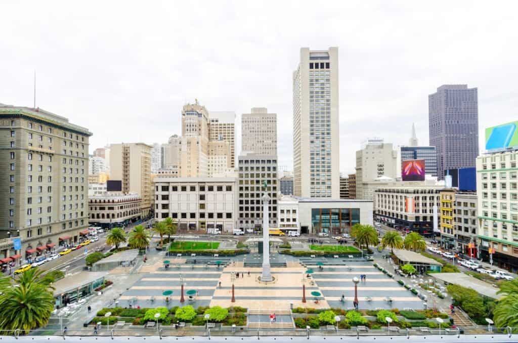 A day view of the Union Square in downtown San Francisco, California, United States. A landmark of the area with a column of a statue of Victory holding a trident on top in the heart of the city center.