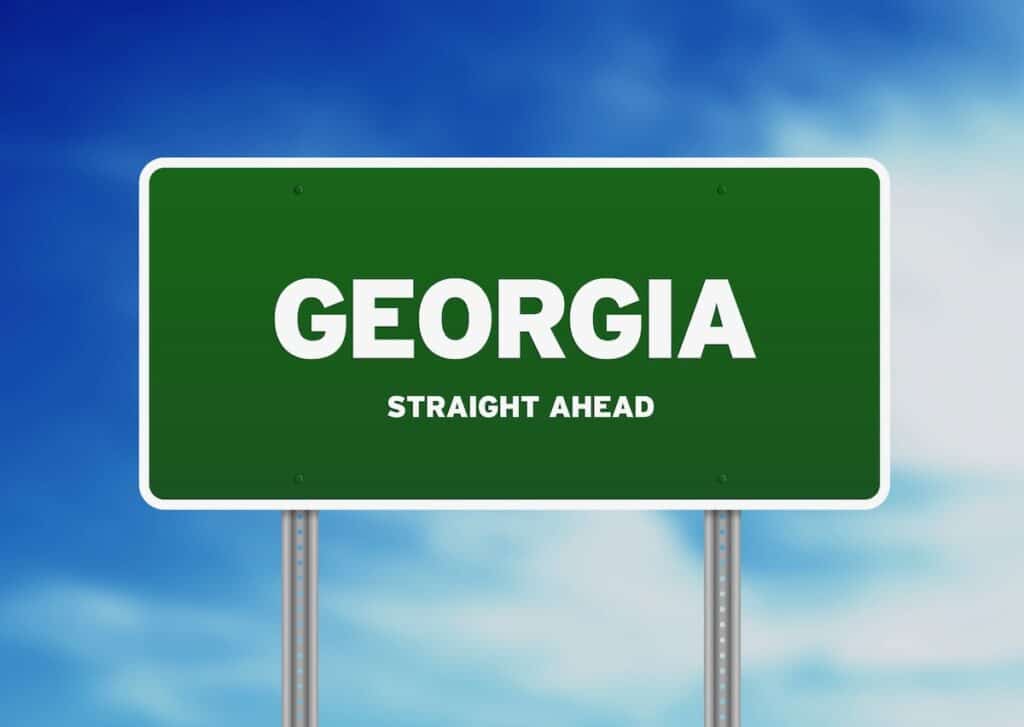 Georgia highway road sign with clouds in a blue sky