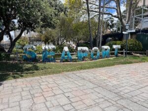 Seaport Village sign located in the middle of Seaport Village along the San Diego Harbor walkway