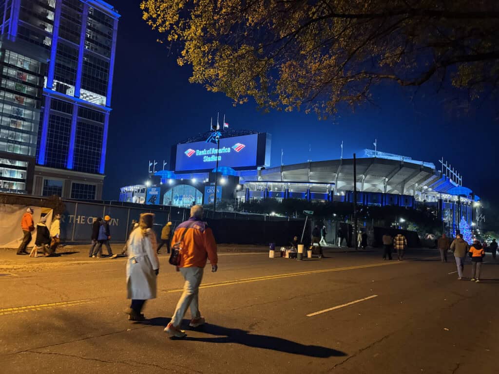 People walking toward the Bank of America Stadium for a night event in uptown Charlotte, NC