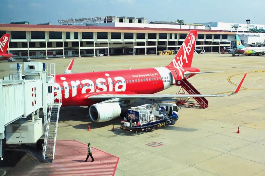 Don Mueang International Airport on in Bangkok with an AirAsia Plane at the gate.