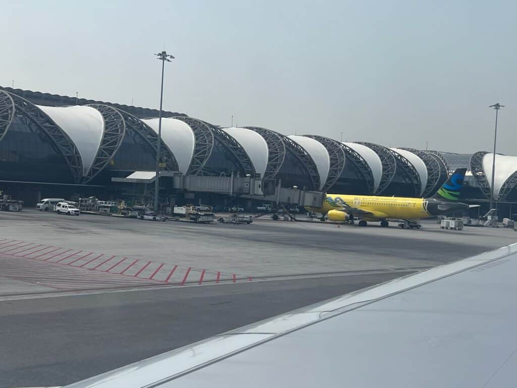 Subanrnabhumi Airport (BKK) in Bangkok with a yellow plane at the gate