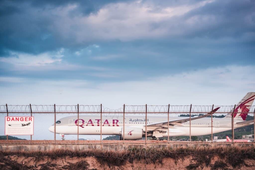 Qatar Airways Boeing 777 Airplane on Runway Track Preparation for Take-Off at Phuket International Airport. Business Transportation and Aviation Commercial Airliner