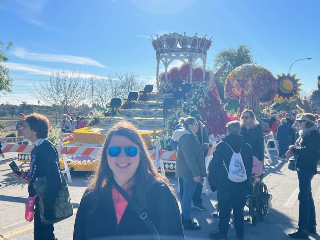 Me standing in front of the float that the rose parade queen and her court were on during the parade