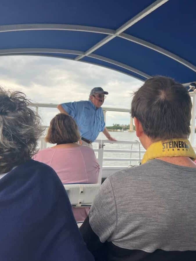 Guide sharing information while on the pontoon boat tour