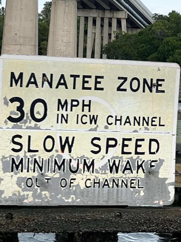 Sign near the bridge close to the pontoon boat dock