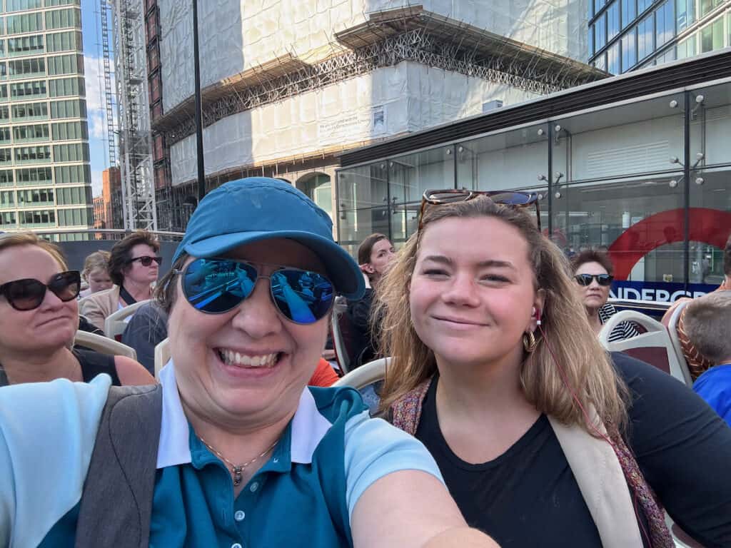 Me and my niece on the top deck of a hop on hop off Big Bus in London