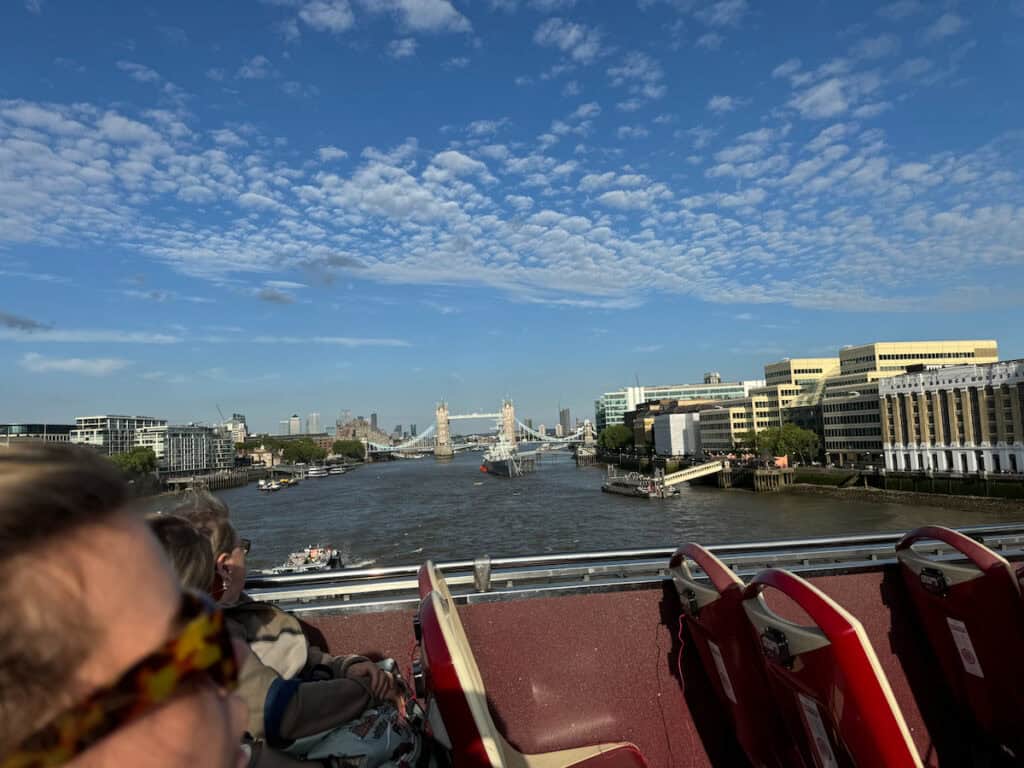 London Bridge picture taken from the top deck of a double decker tour bus across the Thames River