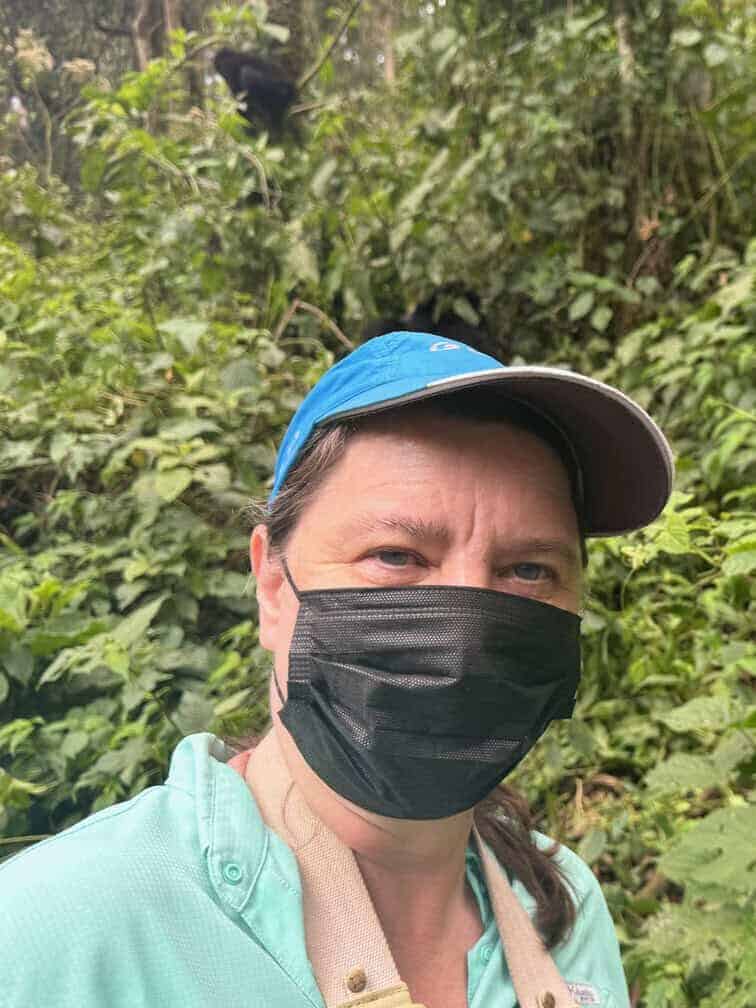Me with two gorllias in the back ground in Uganda's Bwindi National Park