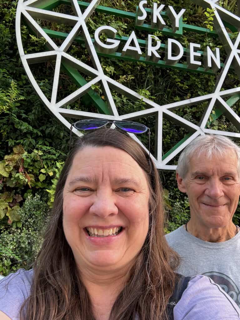 My Husband and I in front of the Sky Garden Sign