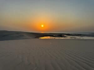 Sunrise over the persian sea from the top of a sand dune near Doha Qatar