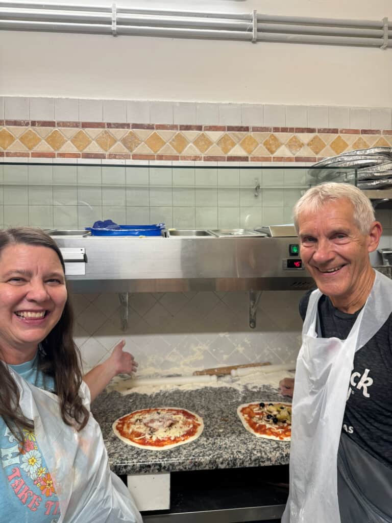 My husband and I making Pizza at a food making tour in Rome Italy