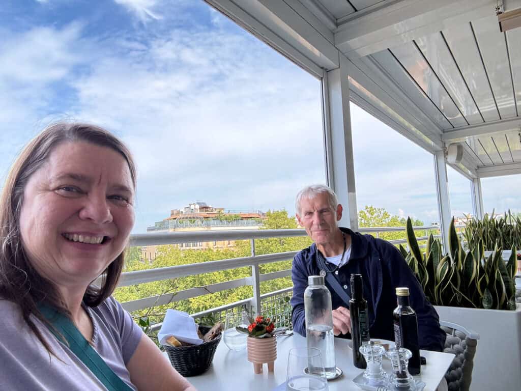 My husband and I eating at the rooftop bar a the Tribune in Rome