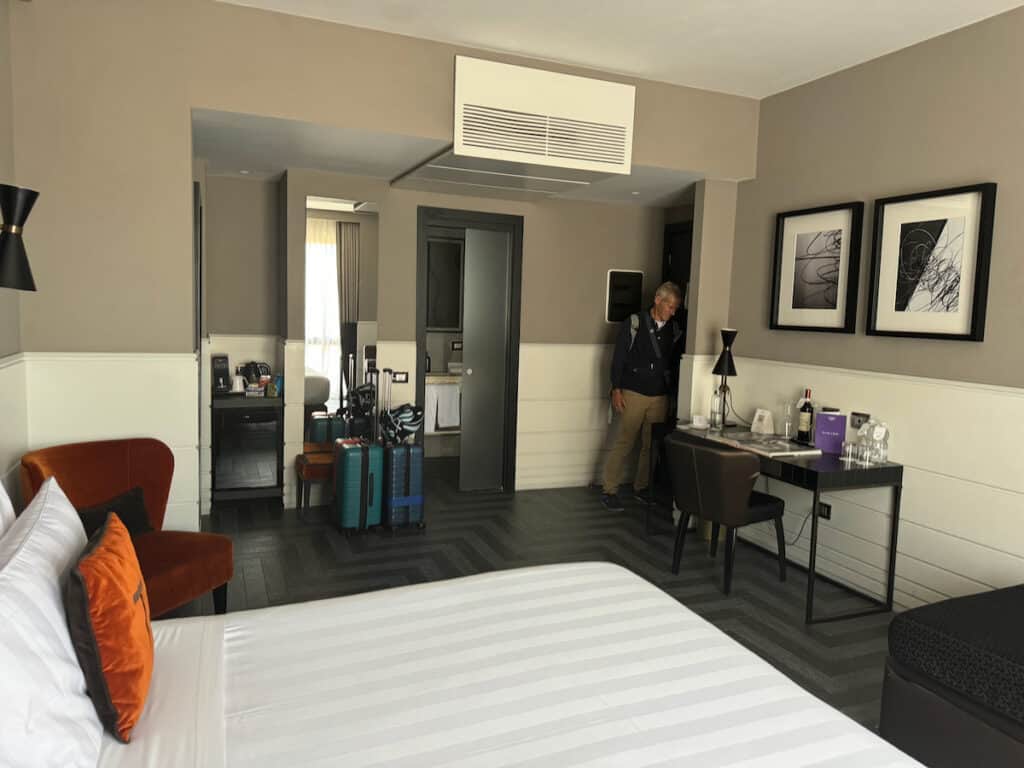 Room at the Tribune with my husband and bathroom in the background