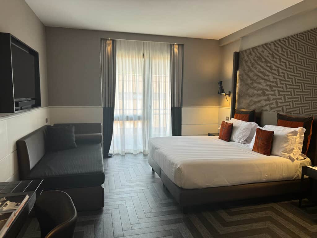 Our room with Kingsize bed and door to balcony at the Tribune in Rome