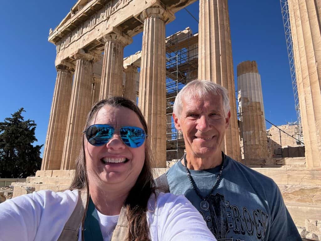My husband and I in front of the parthenon in Athens Greece