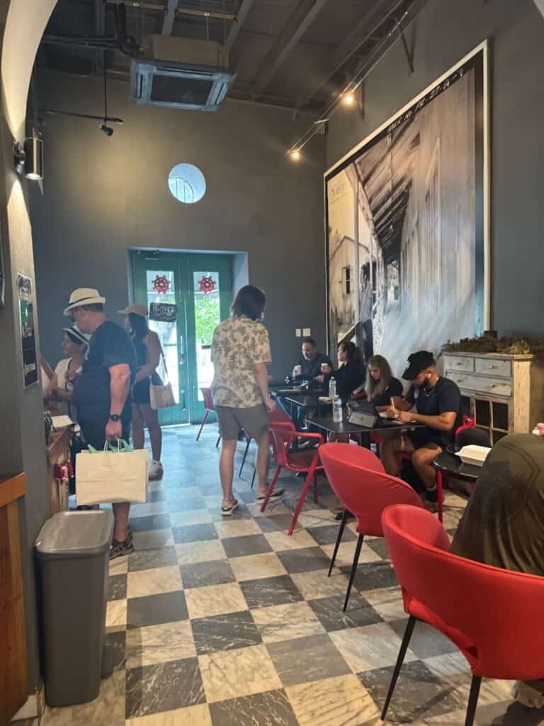 People sitting and waiting on coffee at Cuartro Sombras coffee house in Old San Juan