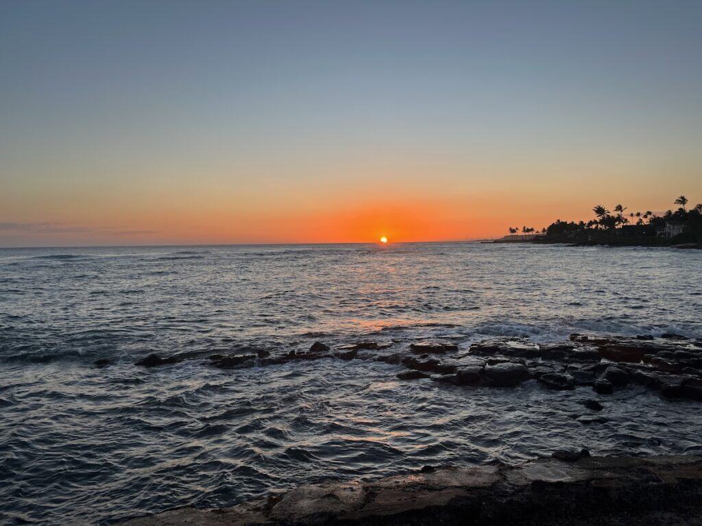 The sun sets over the ocean in Kauai, Hawaii