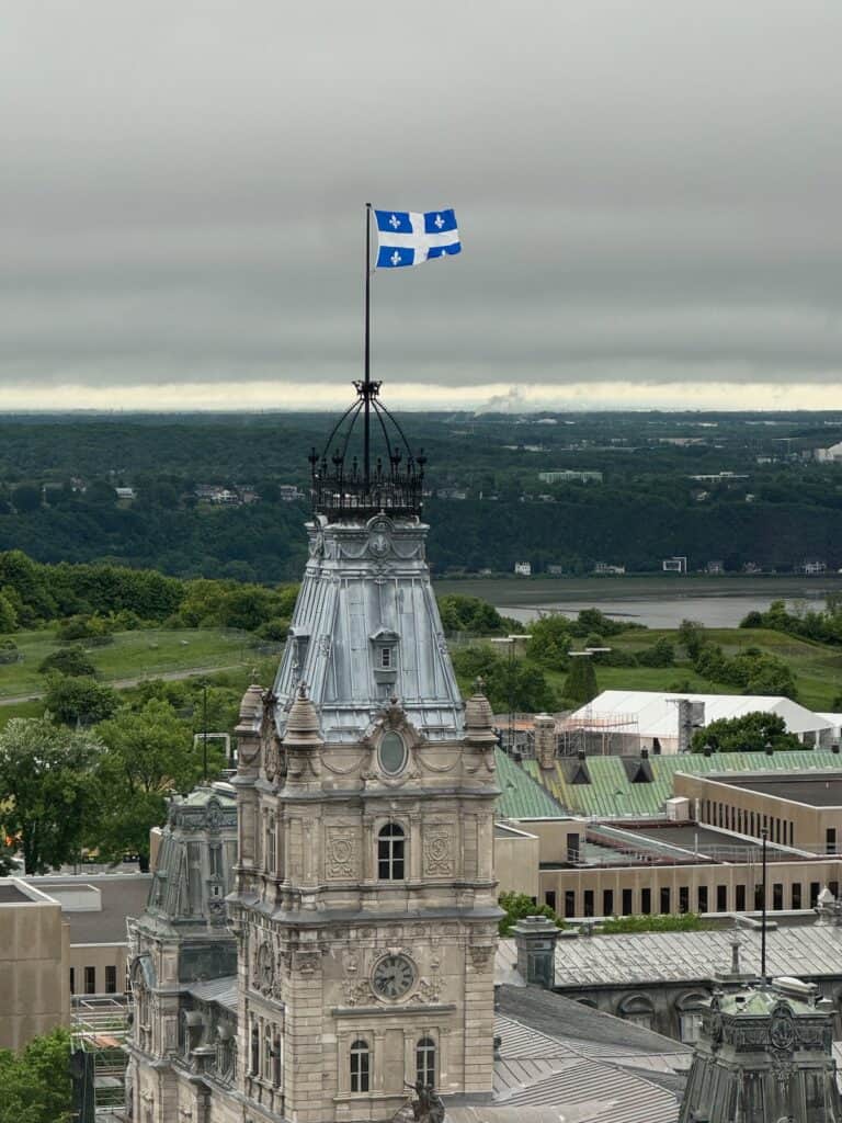 Quebec Flag flying at the top of the parliment building in Quebec City. Taken from our room on 20th floor
