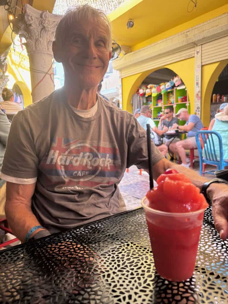 My husband with his strawberry daquiri at the Bearded Clam in Nassau