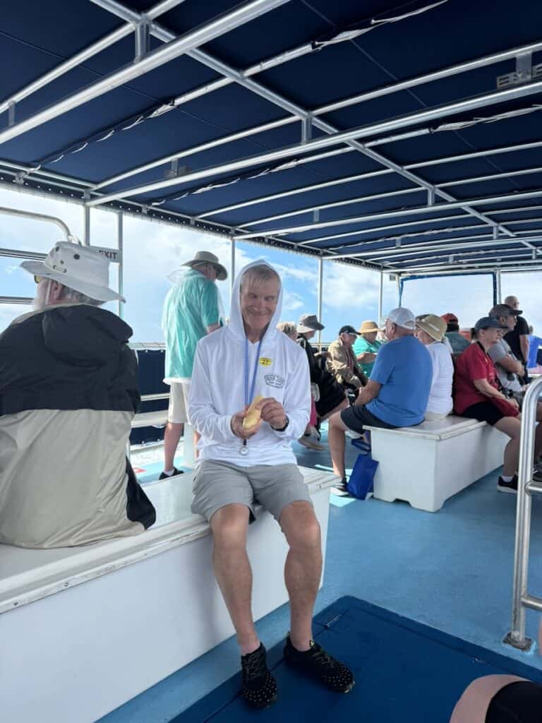 My husband on our boat for the Whale and Dolphin excursion on Dominica