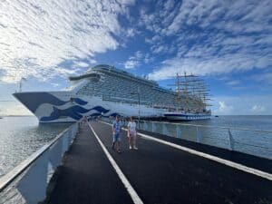 Enchanted Princess with a Clipper Sail Boat in the port of Martinique