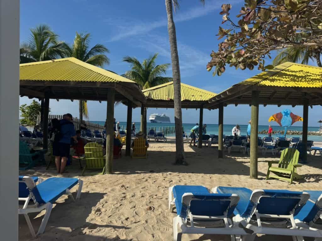 Shaded areas with chairs with the Enchanted Princess in the back ground on Princess Cays