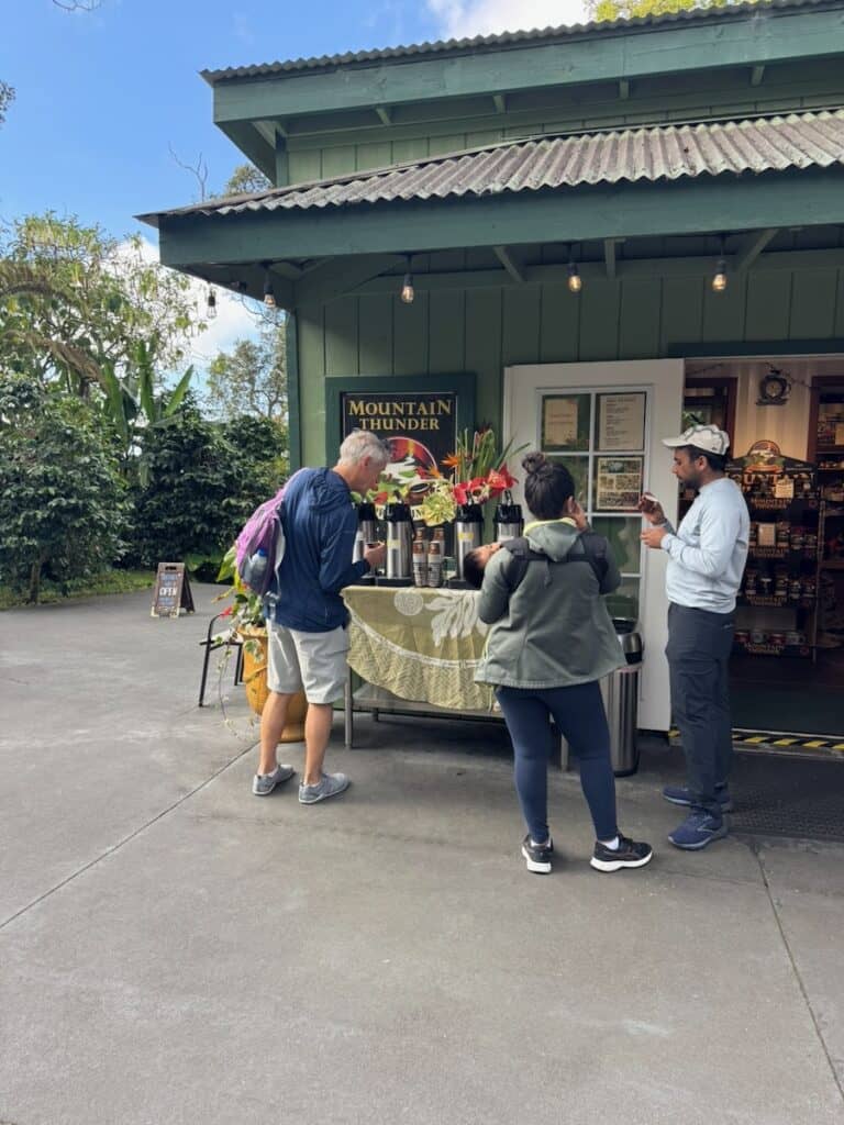 My husband and some others sampling coffee at the Mountain Thunder Coffee Farm