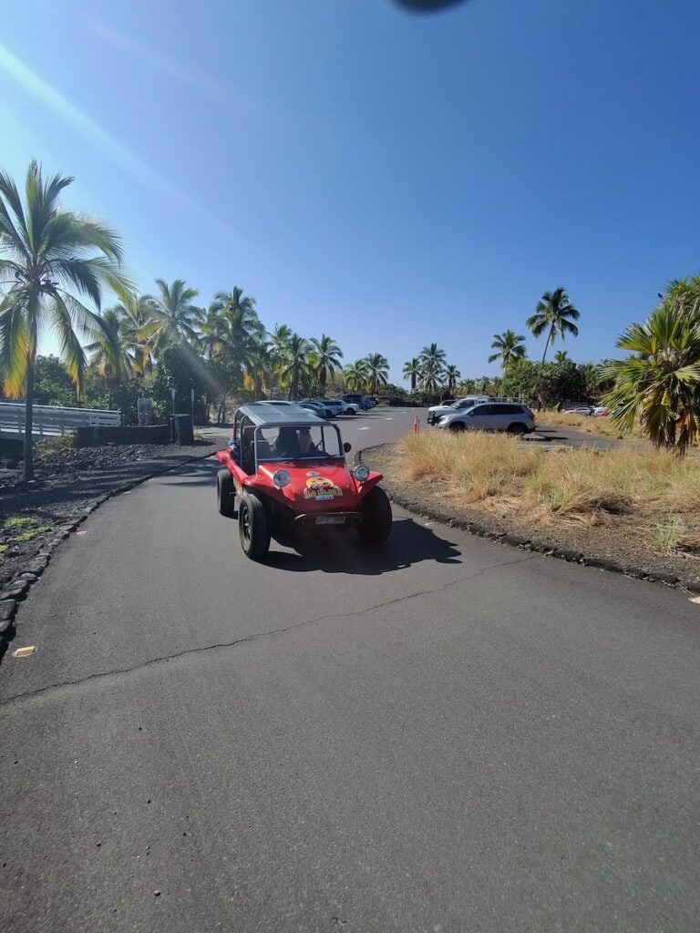 Our red Big Island Buggy leaving the Pu'uhonua O Honaunau National Historical Park on the Big Island