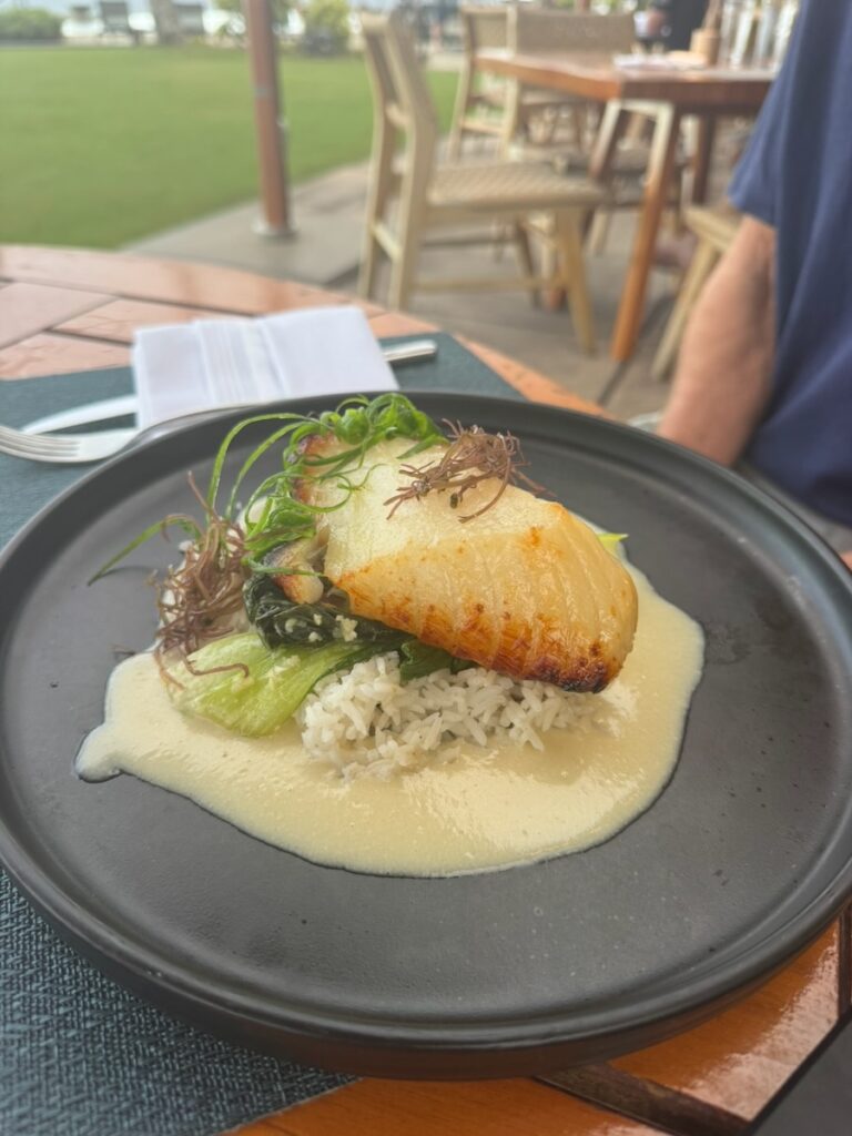My husband's Lemongrass Kona Kampachi with Bok Choy at Hualani Restaurant Kauai