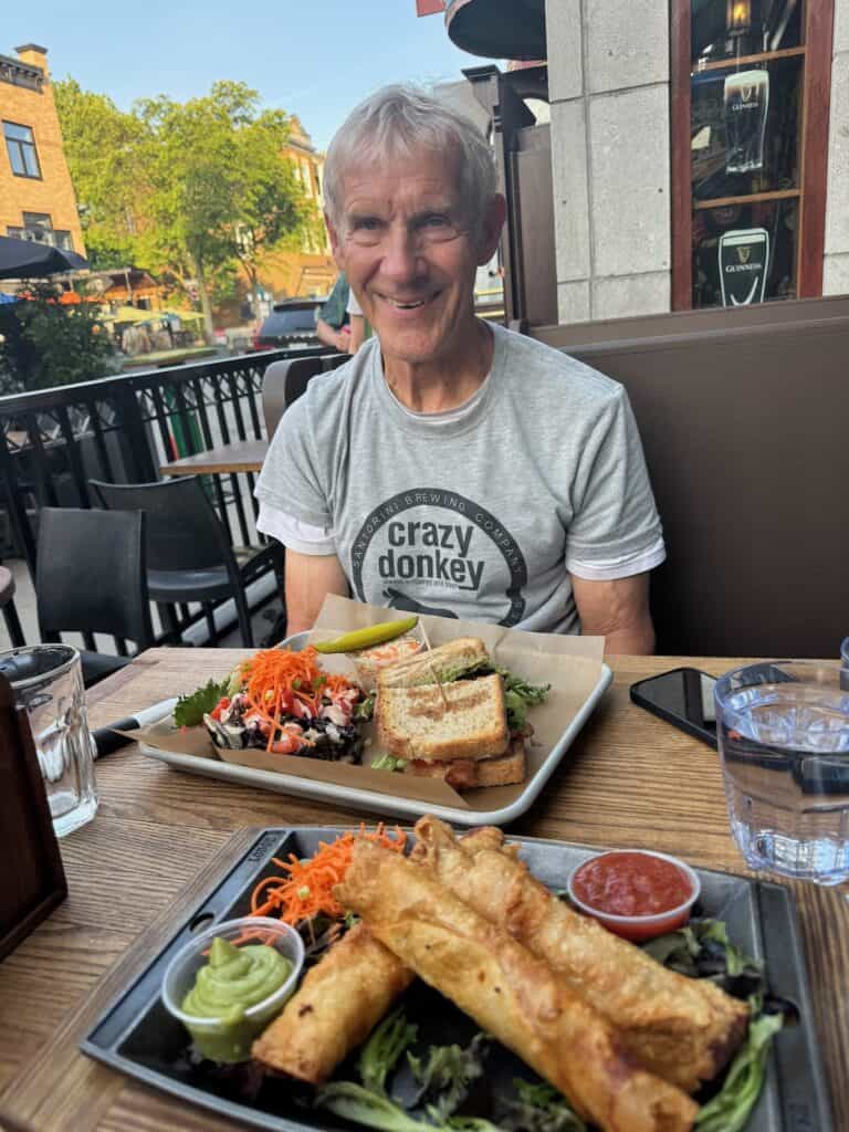 My husband with our meals at the Galway Pub in Quebec City