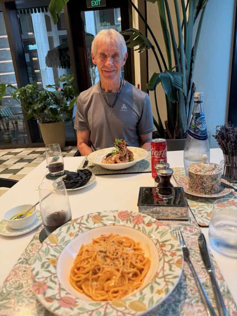 My husband with our dishes at the Anis Restaurant